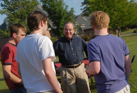President Dockery fellowships with computer science graduates David Moses and Kendal Hershberger at the 2007 Happy Trails social. David and Lanese Dockery host the annual event at their home as a final chance for members of the senior class to fellowship as Union students. - Photo by Morris Abernathy