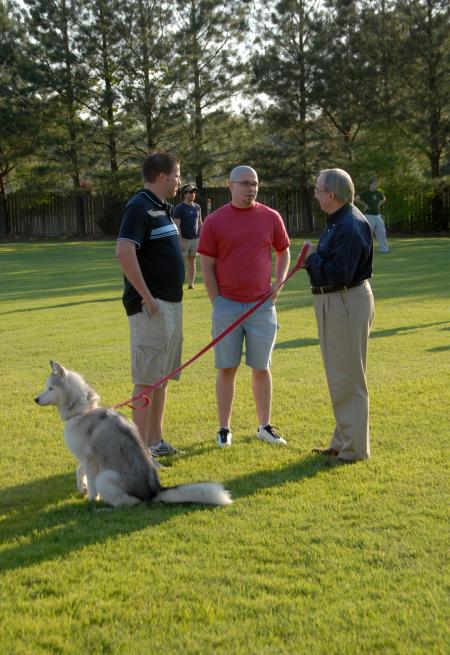President Dockery fellowships with graduates Ryan Hill and Jacob Shatzer during Happy Trails. - Photo by Morris Abernathy