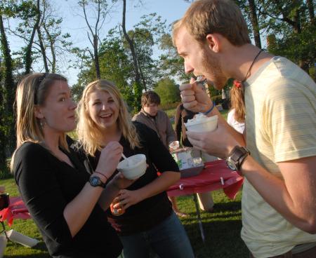 Crystal Kinser Bruno, Beth McDowell and John Kay enjoy ice cream at the Dockery's house during Happy Trails. - Photo by Morris Abernathy