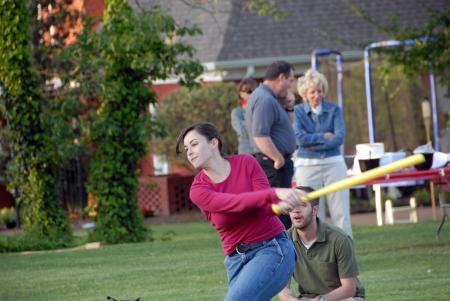 Katherine Kiper swings for the fence in a heated whiffle ball game at Happy Trails. - Photo by Morris Abernathy