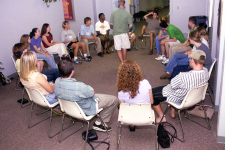 Patrick Feathers leads his FOCUS group in an icebreaker during New Student Orientation. - Photo by Kasey Carty-Campbell