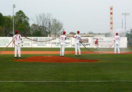 Union players get Fesmire Field ready for play. - Photo by Steven Aldridge