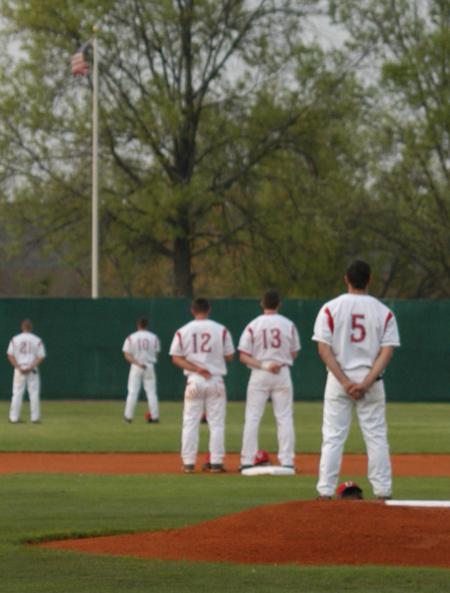 Union starters stand in the field during the playing of the National Anthem. - Photo by Steven Aldridge