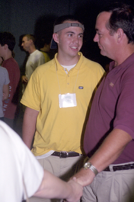 Greg Talley says goodbye his parents after the New Student Orientation worship service. - Photo by Janelle Sou