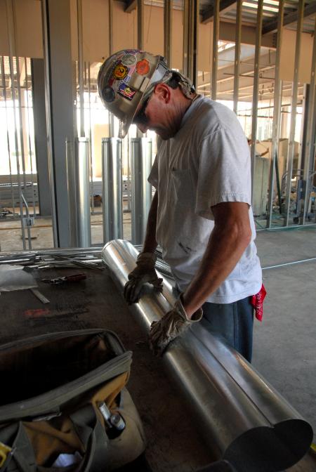 A man works on the complex HVAC system in White Hall. - Photo by Morris Abernathy