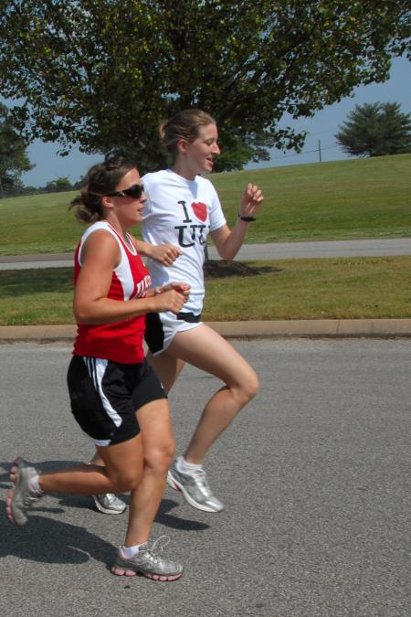 Candace Cross and Lydia Bond run during cross country practice on the Union campus. - Photo by Morris Abernathy