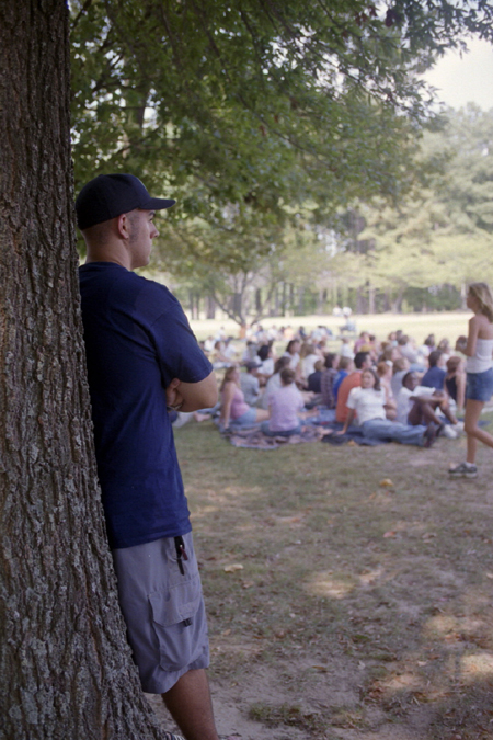 Freshman Jeff Reese takes a minute away from the FOCUS-Festival crowd during New Student Orientation. - Photo by Kasey Carty-Campbell