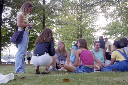 Several freshman ladies enjoy each other's company at a picnic lunch during New Student Orientation. - Photo by Kasey Carty-Campbell