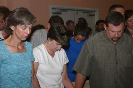 Parents and families encircled the new students during the family chapel as President Dockery prayed over them and their first year at Union.

 - Photo by Stephanie Schroeder