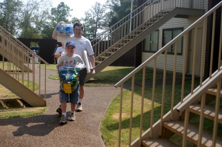 Ray Van Neste receives a little assistance from his son as they both help new students move into their dorms in Hurt Residence Complex. - Photo by Stephanie Schroeder