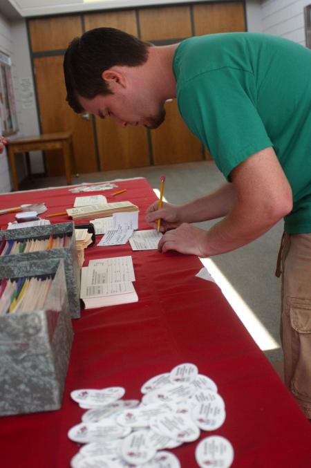 Trey Barnett, Christians Studies transfer student from Olive Branch, Miss., fills out the necessary paperwork for a parking permit from Safety & Security. - Photo by Stephanie Schroeder