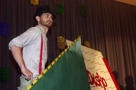 Ronald Long played the mountain man and had to climb the mountain as participants guessed the price of various items during the SAC game show at orientation. - Photo by Stephanie Schroeder