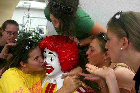 Jill Dake, business major from St. Louis, Ill., Jana Lawson, spanish TESL major from Memphis, Tenn., and other girls from Kirby Maxwell's Focus group blow kisses at Ronald McDonald during their scavenger hunt through Jackson. - Photo by Stephanie Schroeder