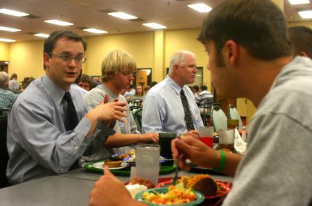 Greg Thornbury, dean of the school of Christian studies, talks with Hunter Bragg from Birmingham, Ala. during the Dinner with your Department event at New Student Orientation. - Photo by Stephanie Schroeder