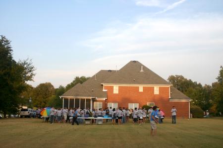 Freshmen enjoy fun and fellowship at President Dockery's house for the annual ice cream social. - Photo by Stephanie Schroeder