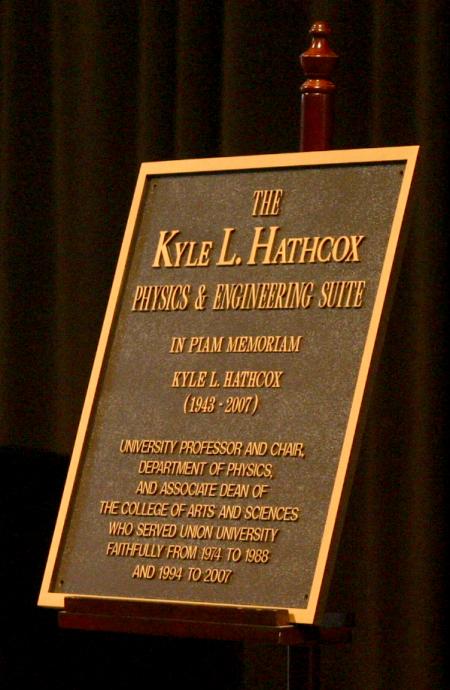 A plaque was presented during the memorial service for Kyle L. Hathcox, university professor and chair of physics and the associate dean of the college of arts and sciences, by naming the physics and engineering suite in honor of him. - Photo by Stephanie Schroeder