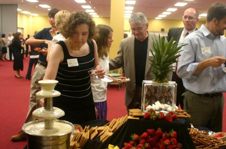 Two chocolate fountains were available at the dessert table where Janna Chance, new instructor of English, and other faculty, staff and students were able to dip various foods during the President's Reception.  - Photo by Stephanie Schroeder