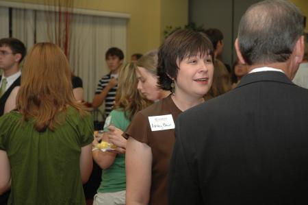 Ashley Blair, assistant professor of communications and organizational leadership, chats with Tom Rosebrough, dean of the college of education and human studies, at the President's Reception. - Photo by Neisha Fuson
