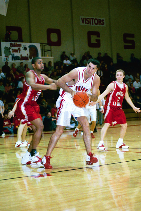 Sophomore Bruno Martinessi (32) is fouled by a Hannibal-LaGrange player. - Photo by Justin Veneman