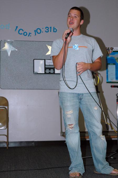 Dave Darty shares his singing ability with new students in the student lounge on Open Mic night.  - Photo by Neisha Fuson