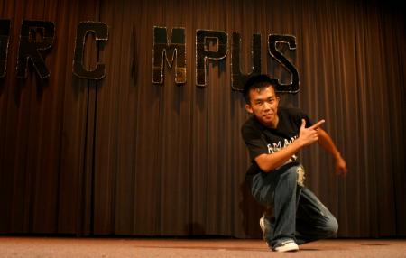 Freshman Chawalit Wongkhaio poses as he is introduced at the beginning of Mr. Campus, an event sponsored by PRSSA. - Photo by Stephanie Schroeder