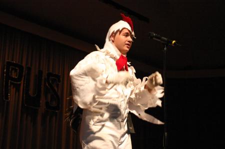 Junior Jonathan Lambach dressed in a full-body chicken costume to dance and sing to the theme song for Duck Tales for his talent during Mr. Campus, an event sponsored by PRSSA. - Photo by Stephanie Schroeder