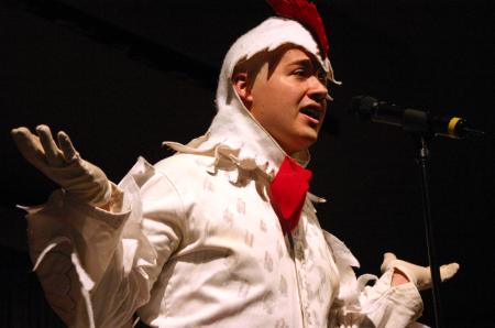 Junior Jonathan Lambach dressed in a full-body chicken costume to dance and sing to the theme song for Duck Tales for his talent during Mr. Campus, an event sponsored by PRSSA. - Photo by Stephanie Schroeder