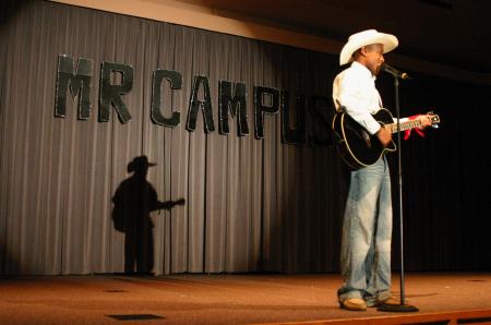 Sophomore Darrion Garrett poses as Josh Turner and sings acapella to a country song for his talent during Mr. Campus, an event sponsored by PRSSA. - Photo by Stephanie Schroeder