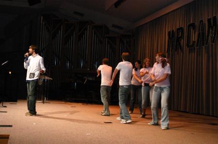 Sophomore Michael Grubb and a his assistants sing and dance to the popular song Baby One More Time as part of Grubb's talent show for Mr. Campus. - Photo by Stephanie Schroeder