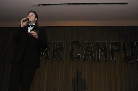 Sophomore Scott McSwain sings a song in full tuxedo as part of the talent portion of Mr. Campus. - Photo by Stephanie Schroeder