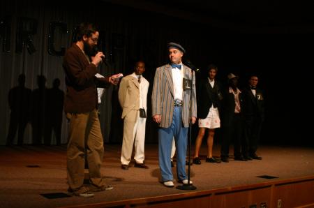 Emcee Joe Garner asks Jonathan Lambach a question during the interview part of Mr. Campus. - Photo by Stephanie Schroeder