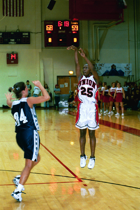 Junior Christal Merriwhether (25) puts up a three-pointer over the head of a Lady Eagle. - Photo by Justin Veneman