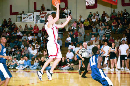 Junior Will Harris (24) goes up for an easy two points. - Photo by Jim Veneman