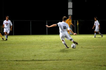 Senior Benny Crozier kicks the ball towards the goal during the first half in Union's 2-1 win against Trevecca Nazarene. - Photo by Matt Elia