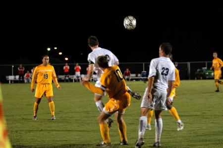 Senior Benny Crozier goes for a header as teammate Franki Mocellin watches. - Photo by Matt Elia