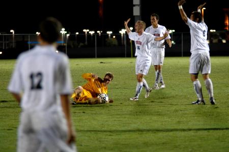 Anthony  O'neal (16), a sophomore, and Veiga Guilherme (6), a freshman, react to the play on the field - Photo by Matt Elia
