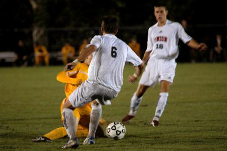 Freshman Veiga Guilherme battles a defender for possession of the ball. - Photo by Matt Elia