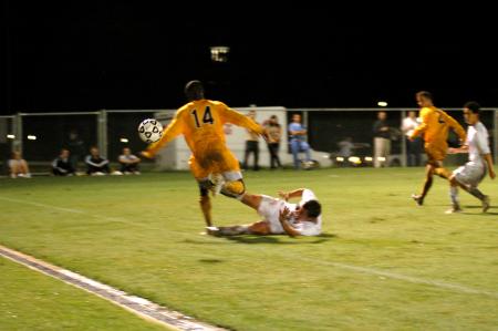 Freshman Franki Mocellin slide tackles an attacking Trevecca forward. - Photo by Matt Elia