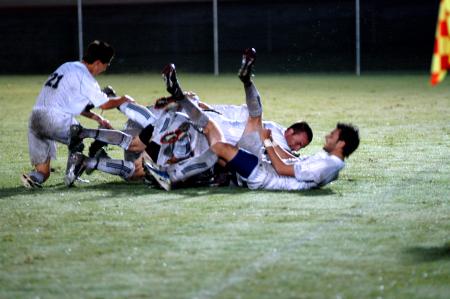 Bulldog celebration after a goal scored by senior Scott <em>Sinky</em> Sinclair. - Photo by Matt Elia