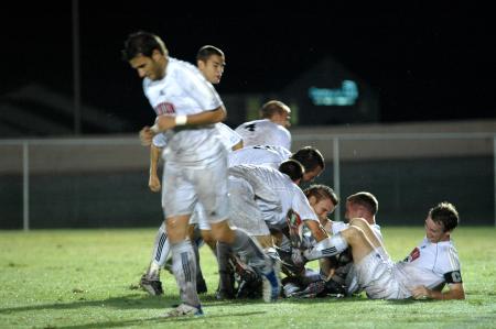 The Union Bulldogs celebrate after a goal scored by senior Scott <em>Sinky</em> Sinclair. - Photo by Matt Elia