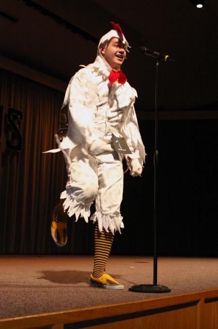 Junior Jonathan Lambach dressed in a full-body chicken costume to dance and sing to the theme song for Duck Tales for his talent during Mr. Campus, an event sponsored by PRSSA. - Photo by Stephanie Schroeder