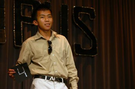 Freshman Chawalit Wongkhaio shows off his evening wear during Mr. Campus. - Photo by Stephanie Schroeder