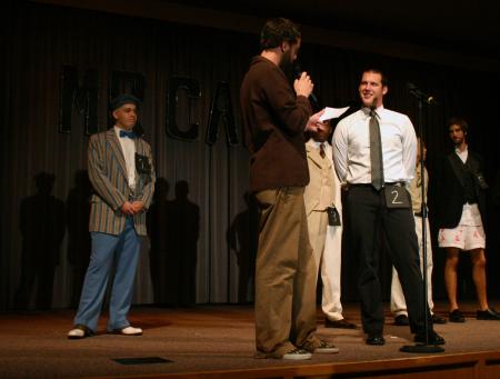 Emcee Joe Garner asks Dave Darty a question during the interview portion of Mr. Campus. - Photo by Stephanie Schroeder
