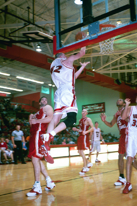 Sophomore Michael Palmer (42) elevates for two in 66-51 win over Hannabal-LaGrange during Homecoming 2003. - Photo by Justin Veneman