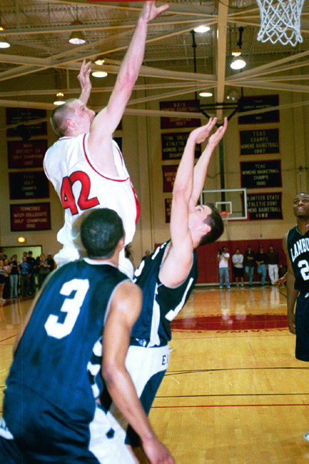 Freshman Michael Palmer (42) goes up for two against Lambuth. - Photo by Justin Veneman