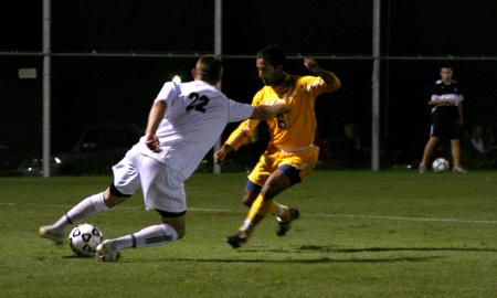 Junior Josh Hanna battles against a defender from Trevecca Nazarene University. The Bulldogs won 2-1. - Photo by Stephanie Schroeder