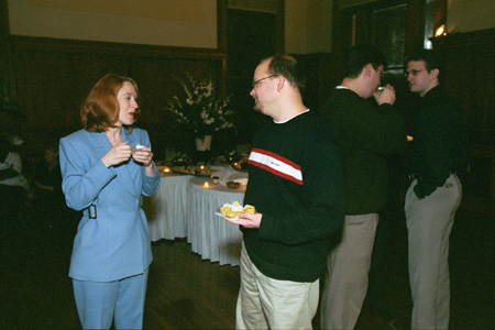 Members of the Class of '93 catch up on old times at their 10-year Reunion held at the Carnegie Library downtown during Homecoming 2003.  Pictured from left to right are Angie (Baker) Nichols, Joel Morgan, Chris Blair, and David Pickett. - Photo by Jim Veneman