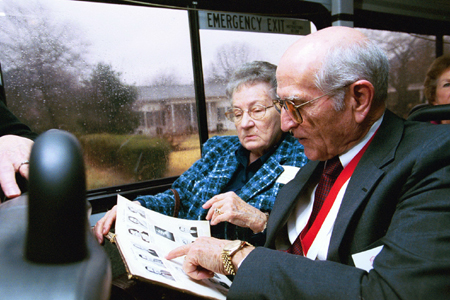Dr. Doyle & Bettye Alexander ('50 & '56) of Nagcodoches, Tex. poured over their yearbooks while taking a driving tour of the old Union campus during Homecoming 2003. - Photo by Jim Veneman