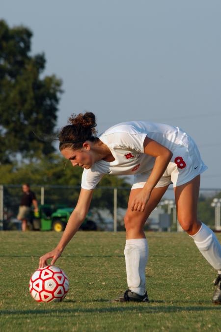 Sophomore Lady Bulldog Roxanna Skelton goes to grab the ball after it had gone out of bounds during the game against Lyon College. - Photo by Neisha Fuson