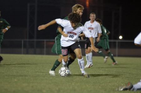 Freshman Edmundo Novarro tries to maintain possession in the midst of a tough Belhaven defense. - Photo by Neisha Fuson